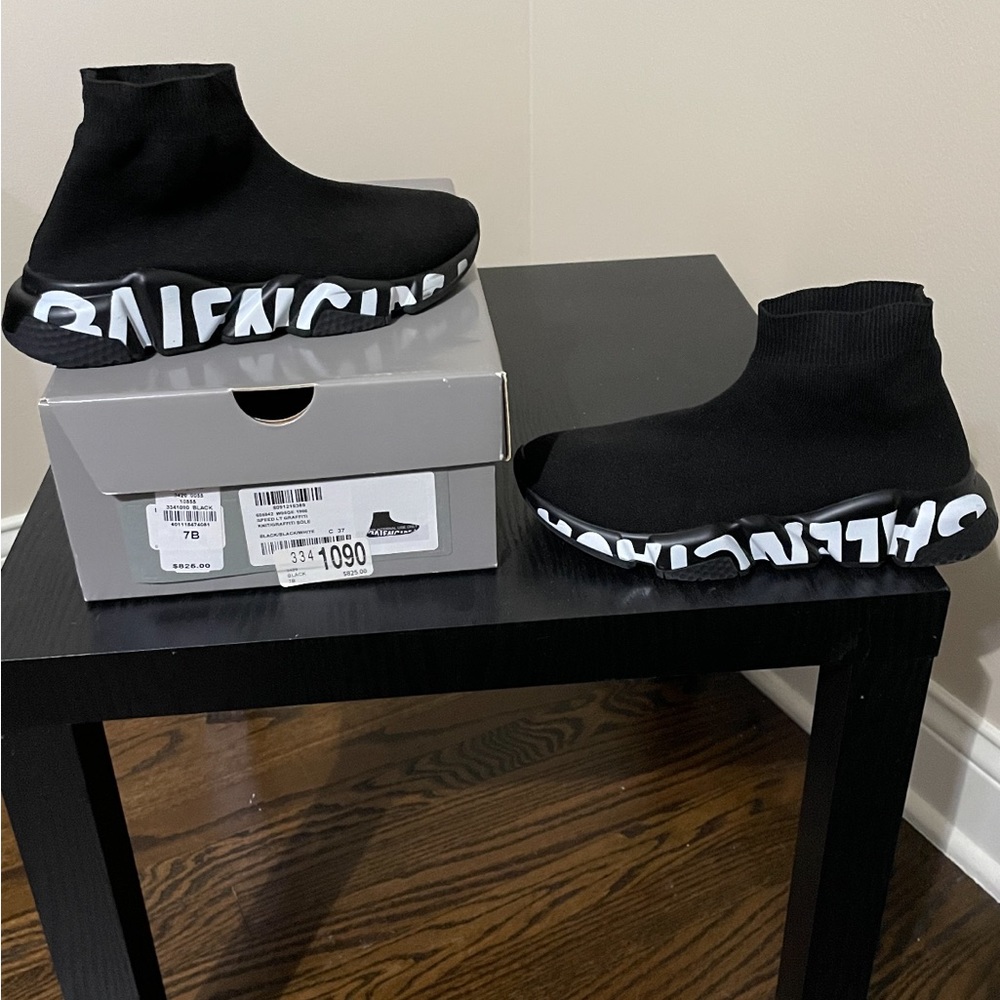 Speed graffiti sneaker in black knit and black and white sole.